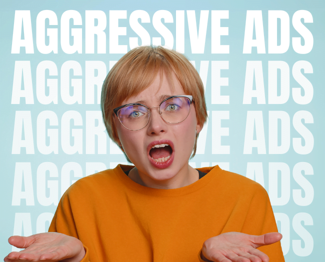 Cliches to Avoid As A Blogger: Woman in glasses and an orange sweater looking annoyed with repeated text 'Aggressive Ads' in the background